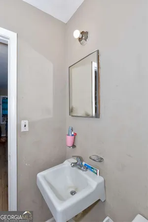 a bathroom with a sink vanity and a mirror