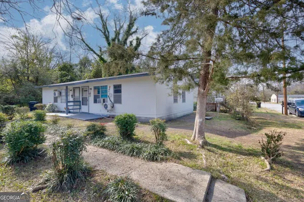 a view of a house with a yard
