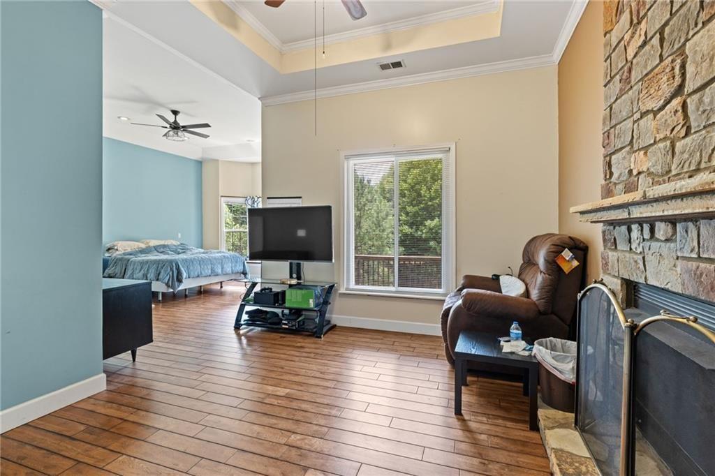 166 Freedom Lane Commerce, GA 30530 - Photo 15 of 23 a living room with furniture fireplace and a flat screen tv