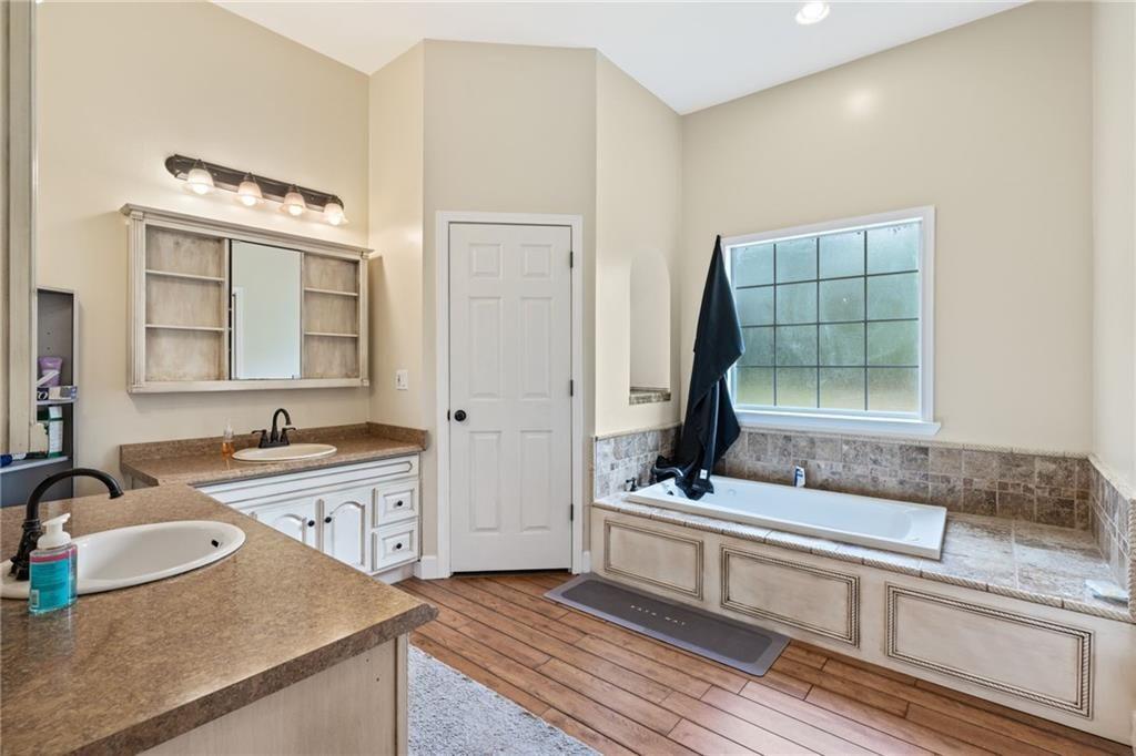 166 Freedom Lane Commerce, GA 30530 - Photo 17 of 23 a bathroom with a sink and a mirror
