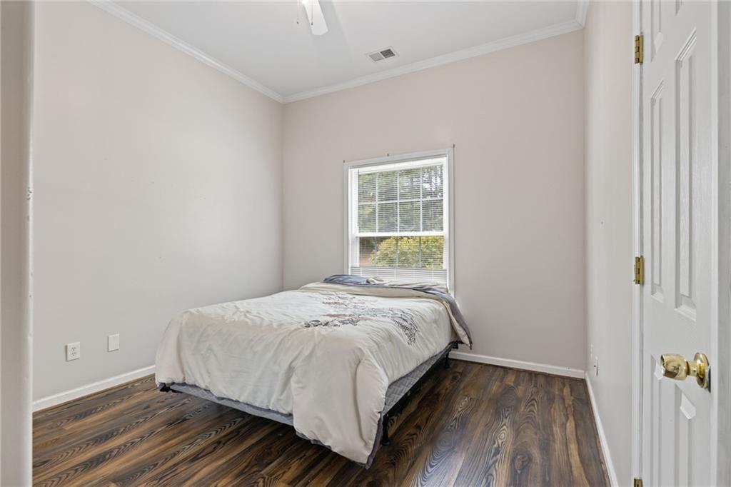 166 Freedom Lane Commerce, GA 30530 - Photo 18 of 23 a bedroom with a bed and a window