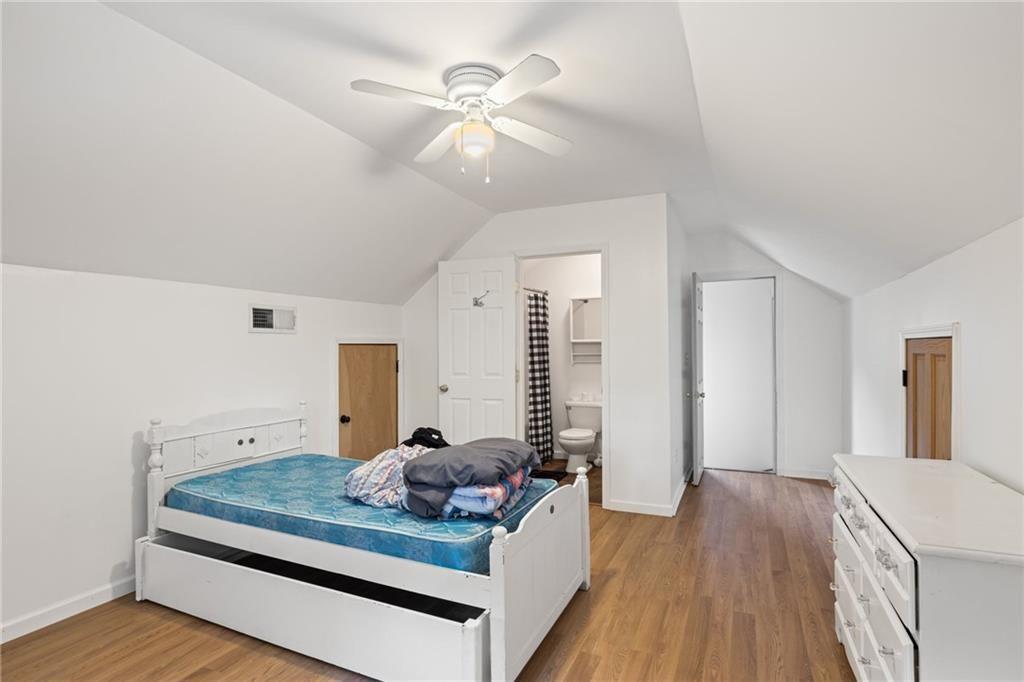 166 Freedom Lane Commerce, GA 30530 - Photo 19 of 23 a living room with furniture and wooden floor