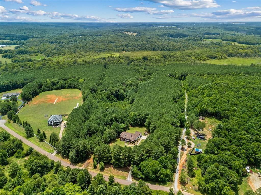 166 Freedom Lane Commerce, GA 30530 - Photo 2 of 23 an aerial view of a residential houses with outdoor space and trees all around