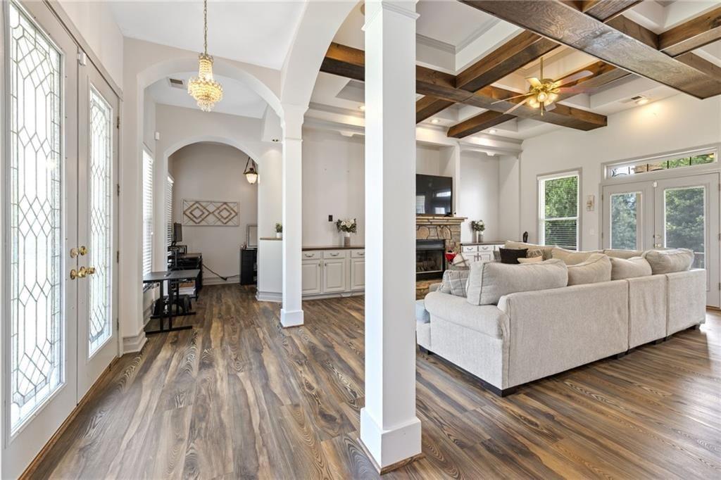 166 Freedom Lane Commerce, GA 30530 - Photo 10 of 23 a living room with furniture and a wooden floor