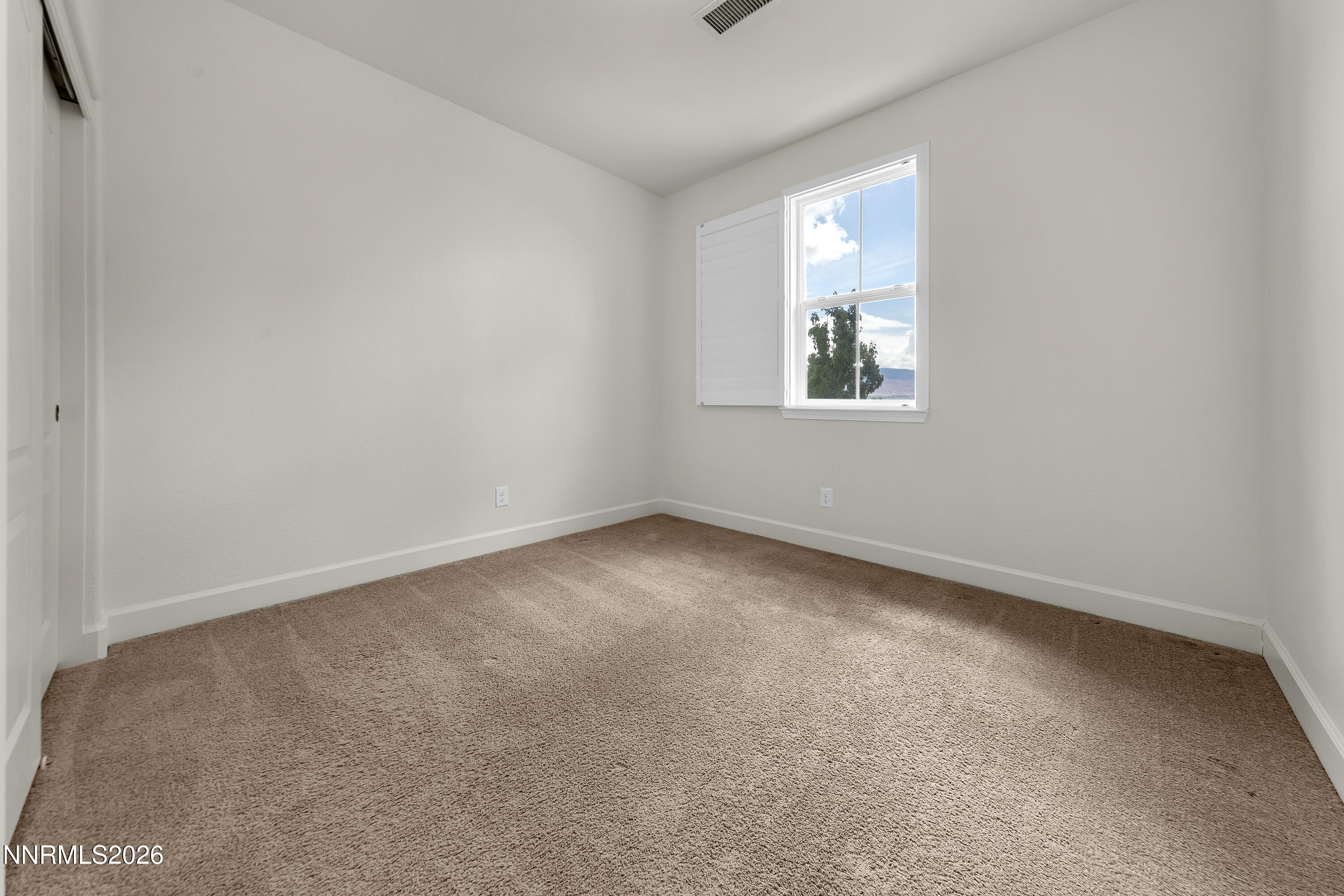 10150 Barrel Racer Drive Reno, NV 89521 - Photo 48 of 64 an empty room with a window