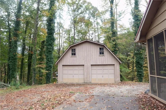 a picture of a glass door with a white house