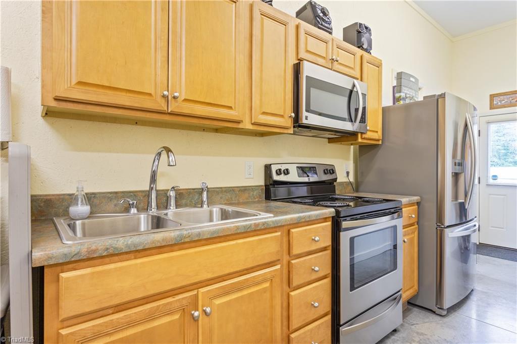 7869 Sutter Road Greensboro, NC 27455 - Photo 39 of 50 Kitchen in office beside detached garage