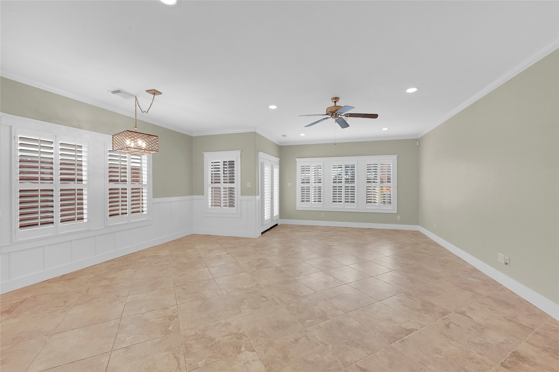 4418 Edsee Street Houston, TX 77009 - Photo 4 of 28 Upon entering, to your right you'll find a gorgeous dining/living combination room complete with wainscotting, plantation blinds, and a ton of natural light.