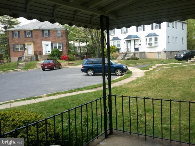 790 Charing Cross Road Baltimore, MD 21229 - Photo 2 of 14 a view of a porch with furniture and a yard