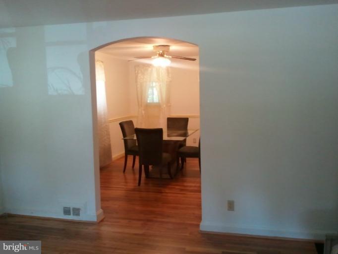 790 Charing Cross Road Baltimore, MD 21229 - Photo 4 of 14 a view of a dining room with furniture and wooden floor