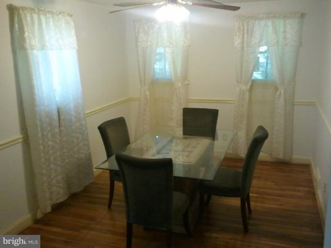 790 Charing Cross Road Baltimore, MD 21229 - Photo 9 of 14 a view of a dining room with furniture and wooden floor