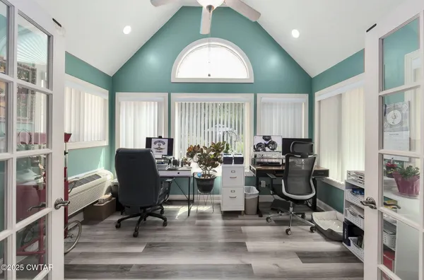 a kitchen with a refrigerator and cabinets