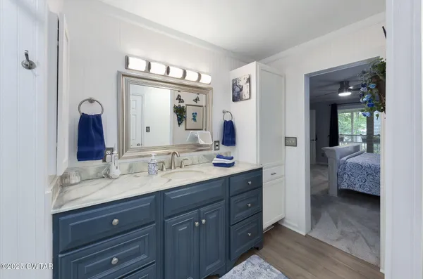 a view of hallway with wooden floor