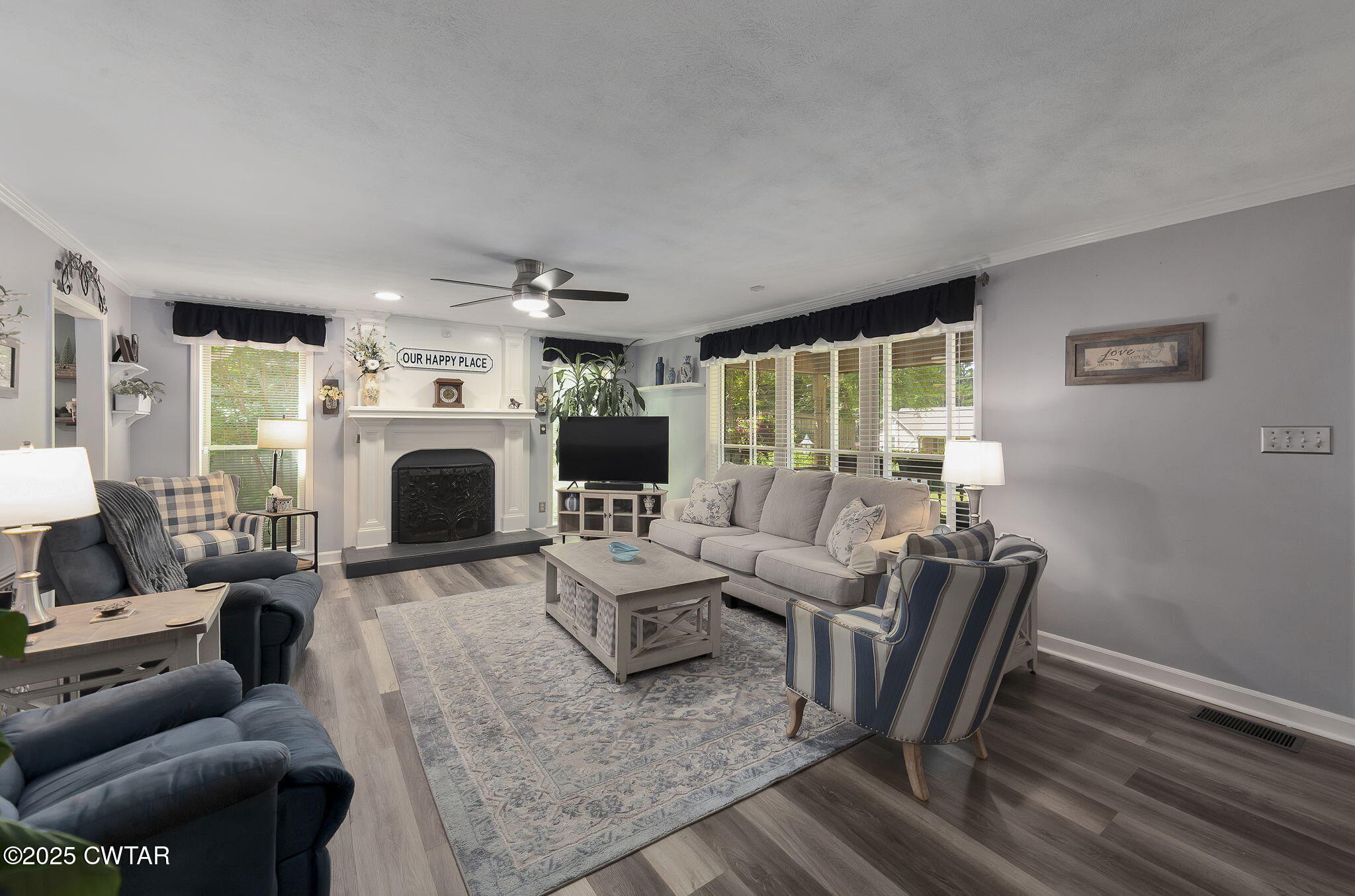 160 Plantation Road Jackson, TN 38305 - Photo 3 of 50 a living room with furniture a fireplace and a table