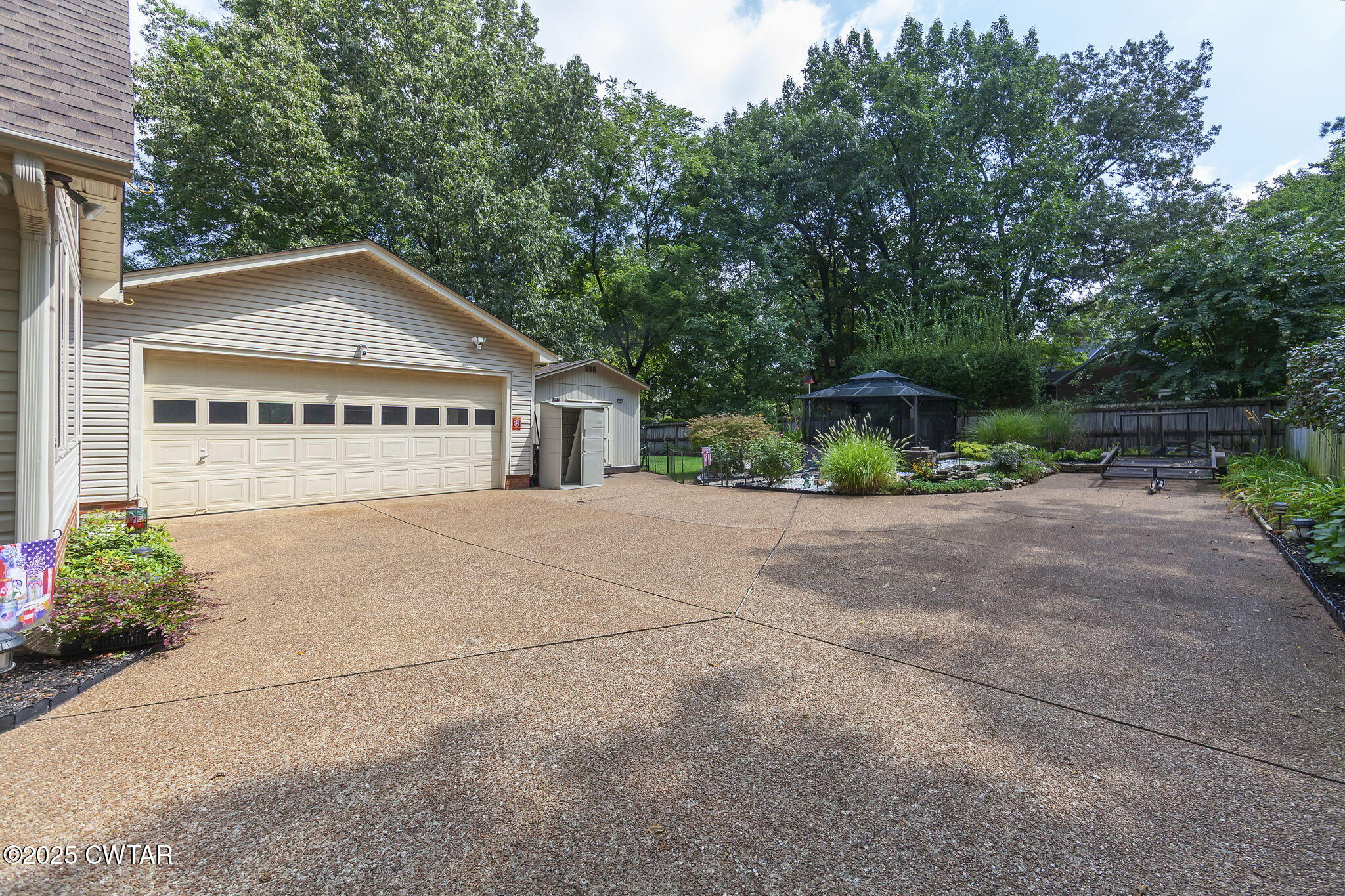 160 Plantation Road Jackson, TN 38305 - Photo 32 of 50 a front view of a house with a yard and garage