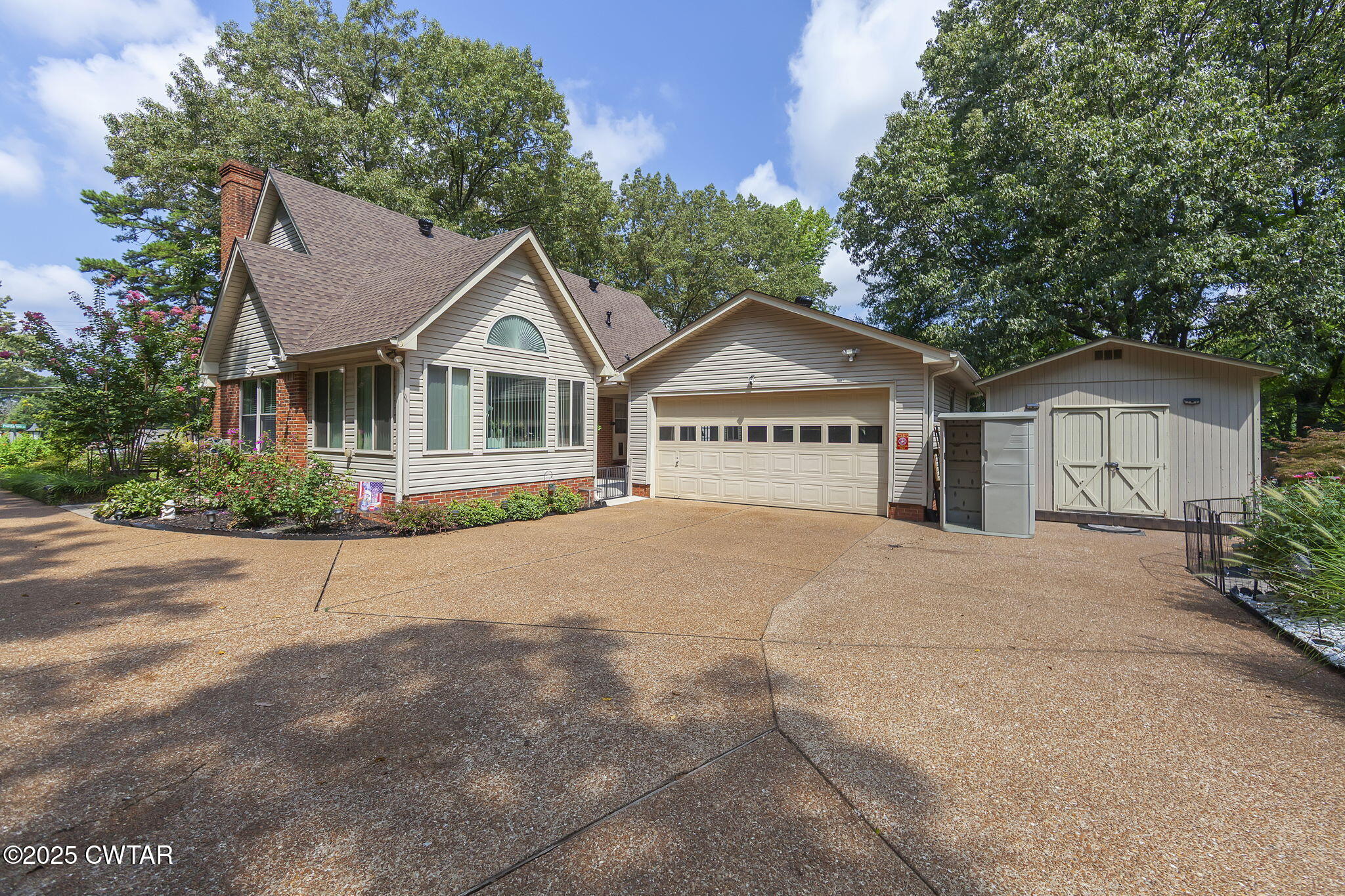 160 Plantation Road Jackson, TN 38305 - Photo 33 of 50 a view of a house with a yard and large trees
