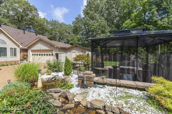 a view of a backyard with a garden