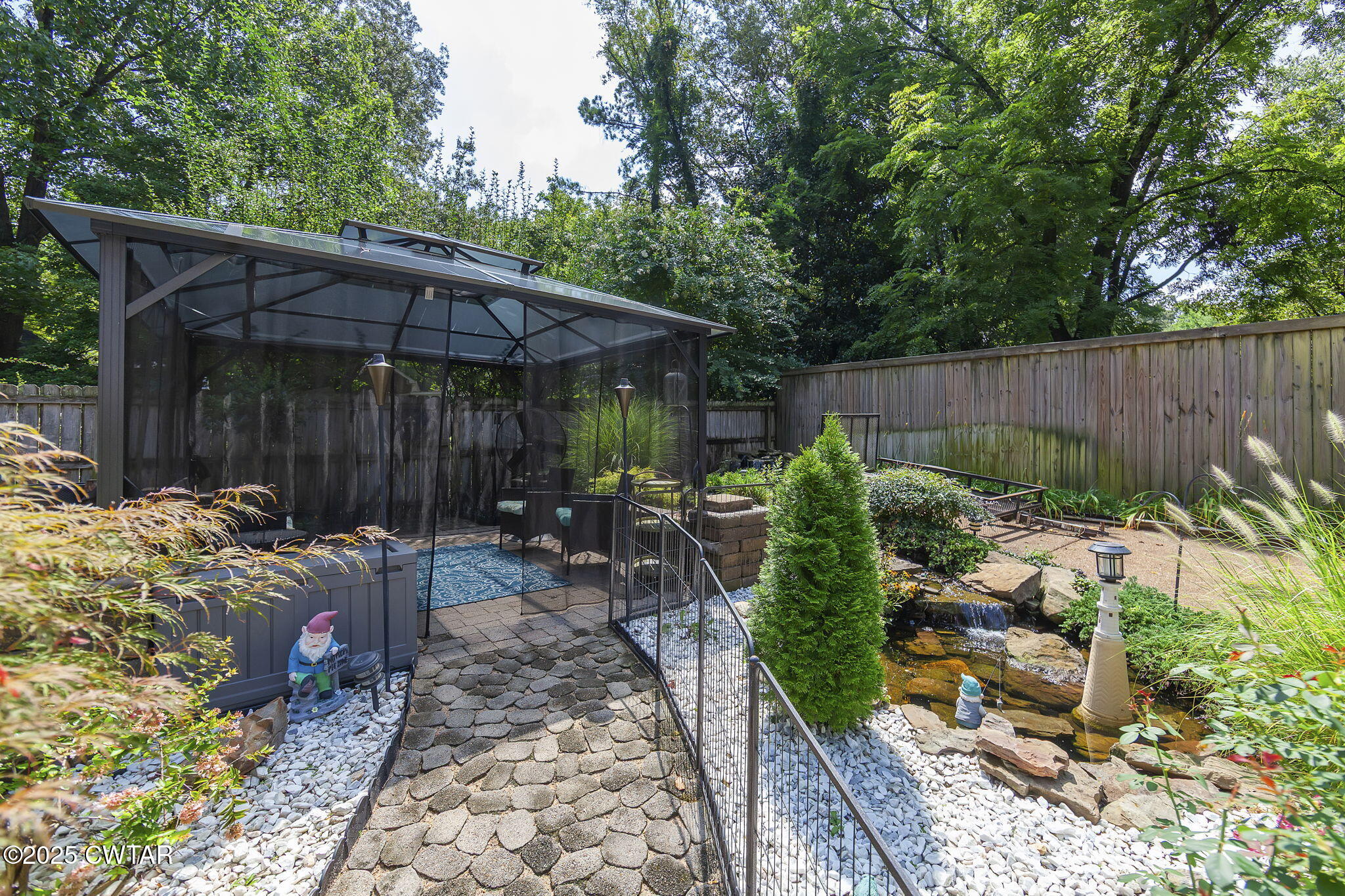 160 Plantation Road Jackson, TN 38305 - Photo 37 of 50 a view of a backyard with plants and a patio