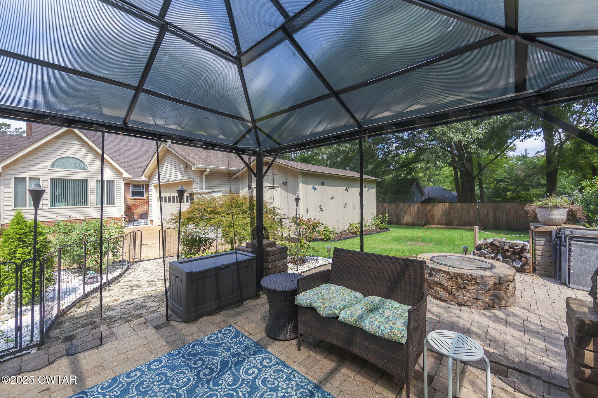 160 Plantation Road Jackson, TN 38305 - Photo 39 of 50 a view of a patio with couches chairs and a big yard