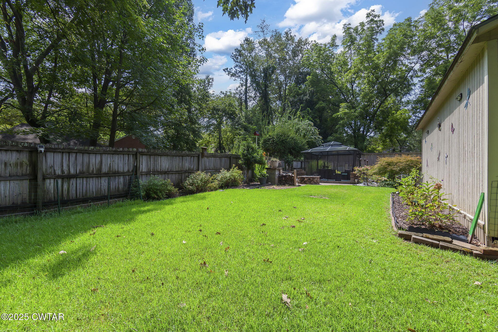 160 Plantation Road Jackson, TN 38305 - Photo 43 of 50 a view of a backyard with a garden