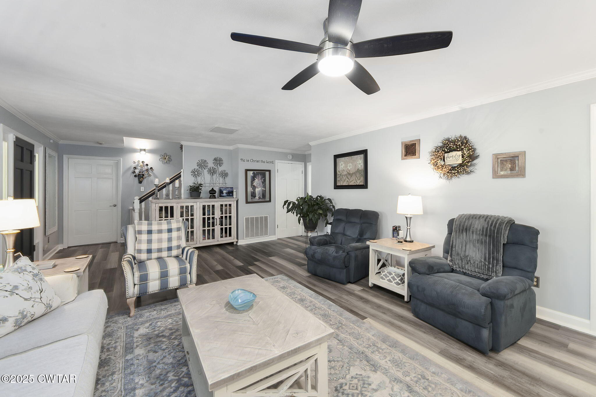 160 Plantation Road Jackson, TN 38305 - Photo 6 of 50 a living room with furniture a chandelier fan and a rug