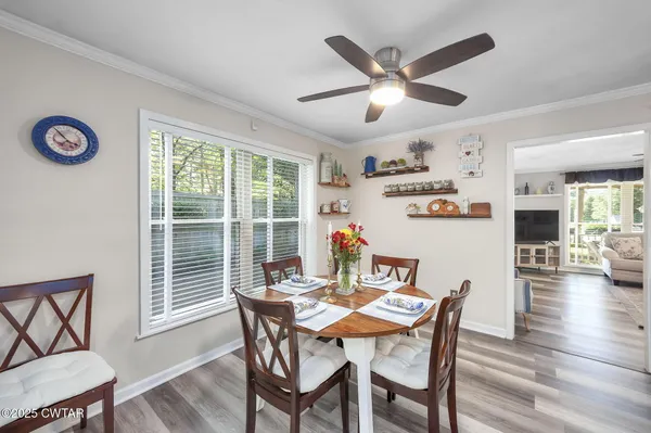 a view of a dining room with furniture window and outside view