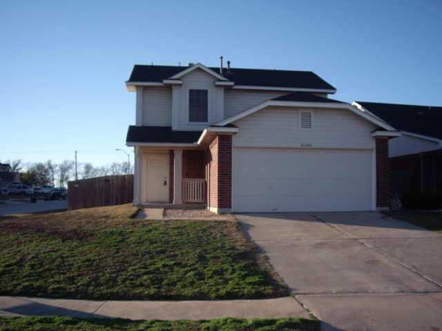 21204 Secretariat Ridge Lane Pflugerville, TX 78660 - Photo 1 of 1 a front view of a house with a yard