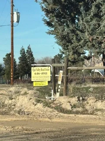 a view of a street with trees