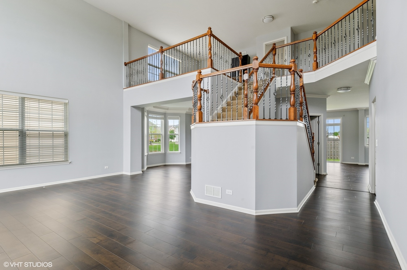 1439 Viola Lane Volo, IL 60073 - Photo 7 of 11 a view of a room with wooden floor and windows