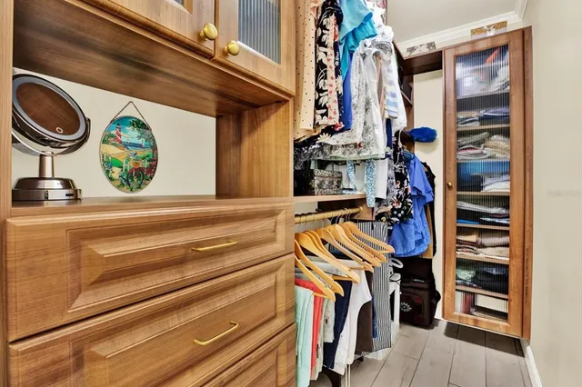 a room with a dresser and a window