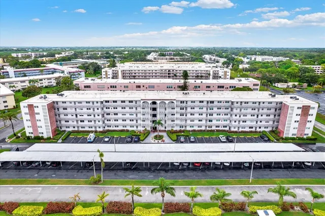 a view of a swimming pool and a lot of buildings