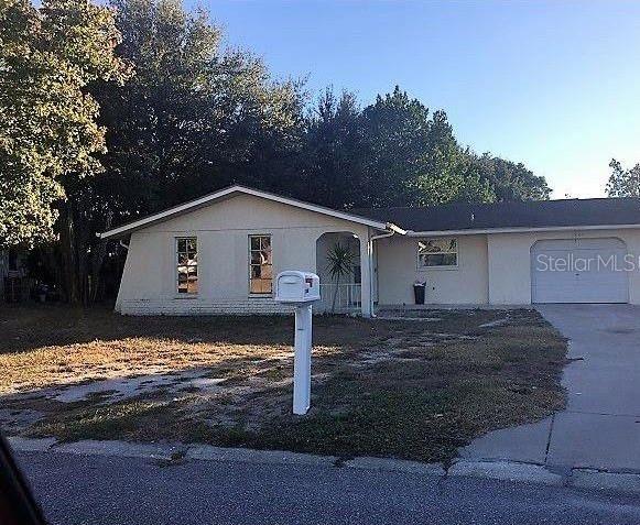 7836 Portage Drive Port Richey, FL 34668 - Photo 1 of 1 a view of a house with backyard