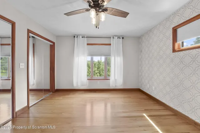 a bathroom with a sink a shower and a mirror