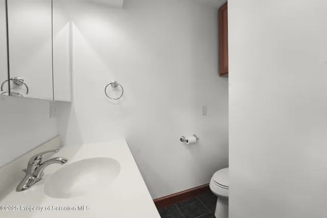 a bathroom with a bathtub and a sink