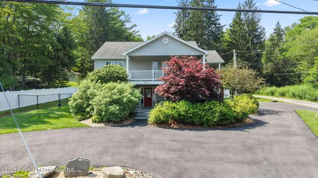 a view of a balcony with wooden floor