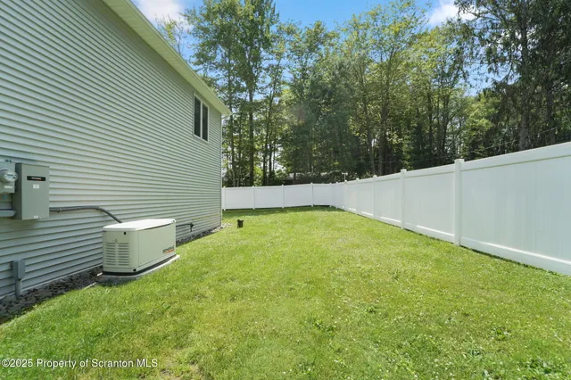 a view of a patio with table and chairs and potted plants