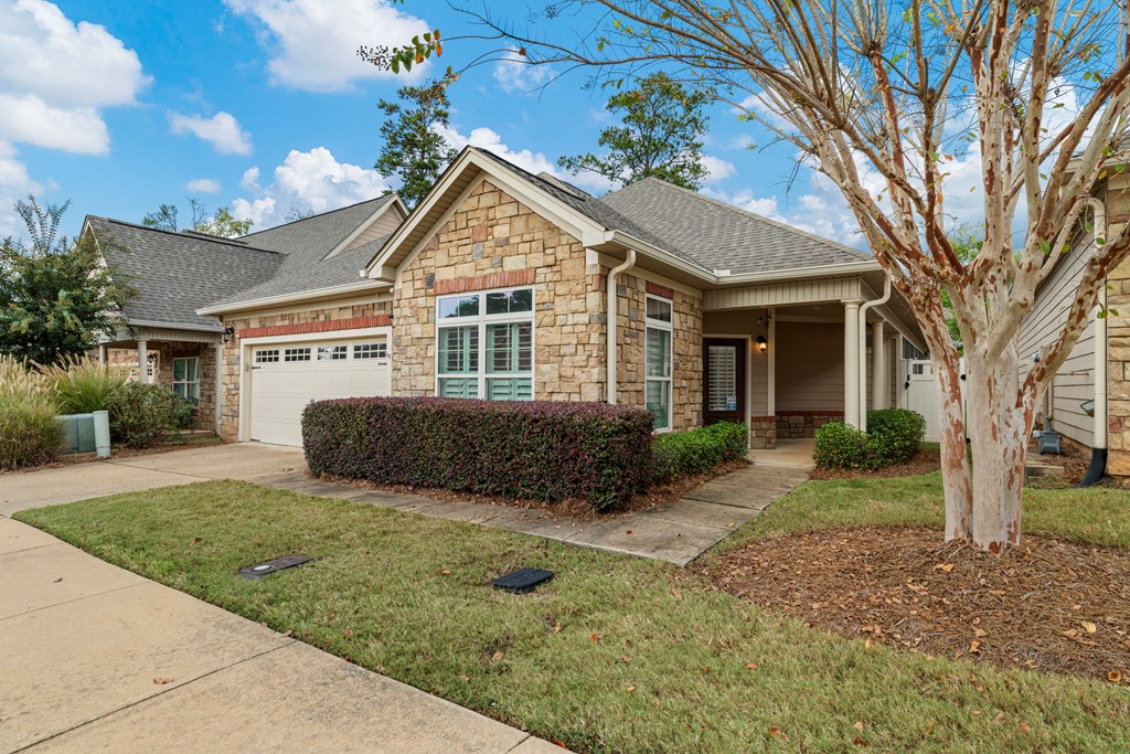 8848 Promenade Place Columbus, GA 31820 - Photo 15 of 21 a view of a yard in front of a house with large windows