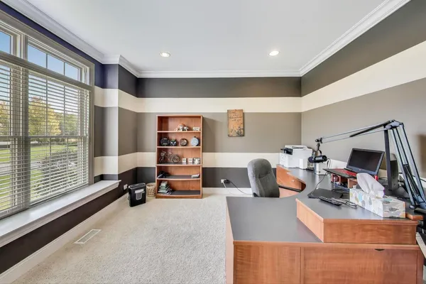 a bathroom with a granite countertop toilet sink and mirror