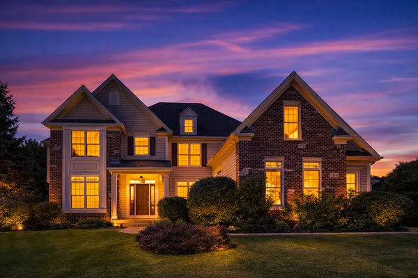 a front view of a house with a yard
