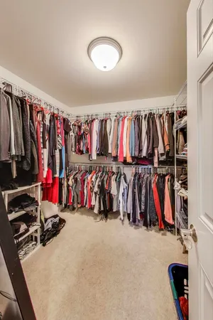 a bed sitting in a room next to a window