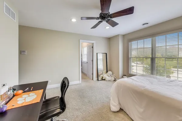 a large kitchen with stainless steel appliances granite countertop a large counter top a stove and a sink