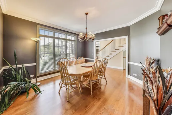 a kitchen with granite countertop a center island a sink stainless steel appliances and cabinets