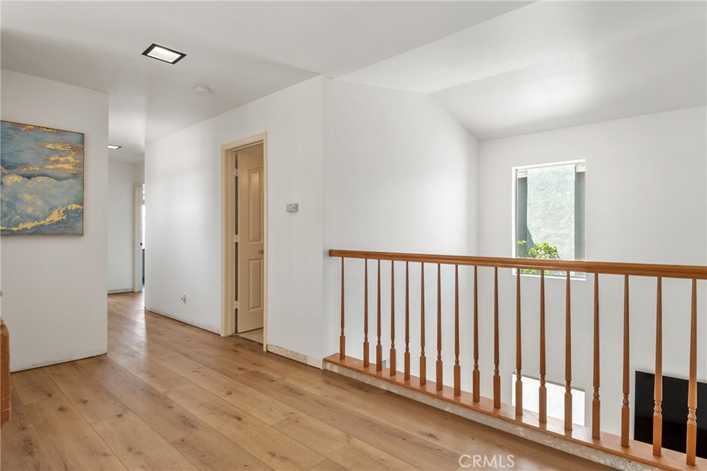 9376 Ruby Red Court Riverside, CA 92508 - Photo 20 of 54 a view of a hallway with wooden floor