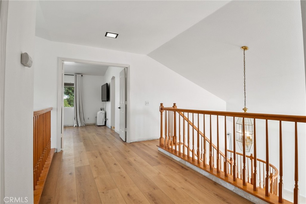 9376 Ruby Red Court Riverside, CA 92508 - Photo 21 of 54 a view of a hallway with wooden floor