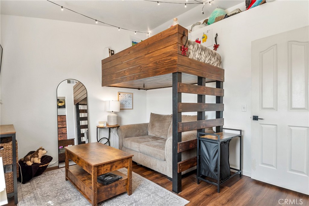 9376 Ruby Red Court Riverside, CA 92508 - Photo 29 of 54 a living room with furniture and wooden floor