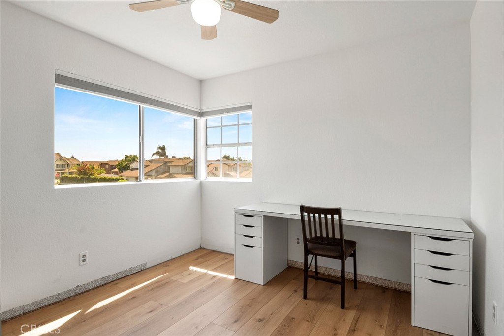 9376 Ruby Red Court Riverside, CA 92508 - Photo 30 of 54 a view of a workspace with furniture and a window