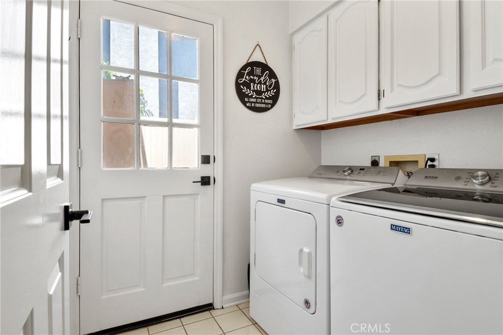 9376 Ruby Red Court Riverside, CA 92508 - Photo 33 of 54 a view of a storage and utility room with washer and dryer