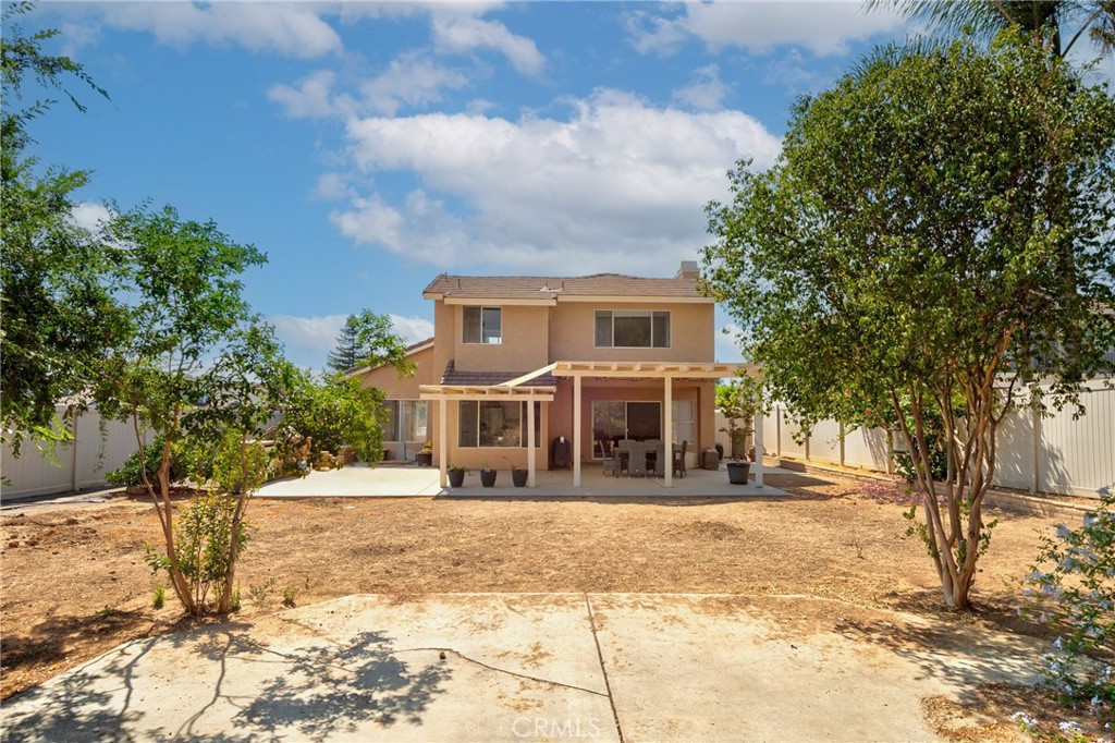 9376 Ruby Red Court Riverside, CA 92508 - Photo 37 of 54 a front view of a house with a yard