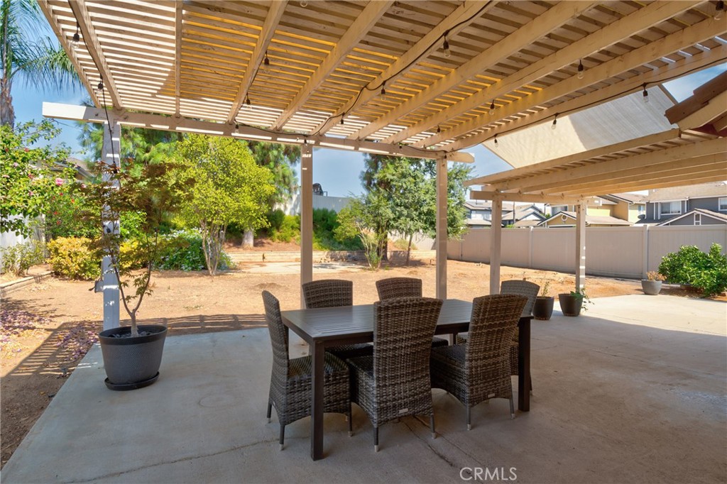 9376 Ruby Red Court Riverside, CA 92508 - Photo 41 of 54 a view of an outdoor space with a table and chairs