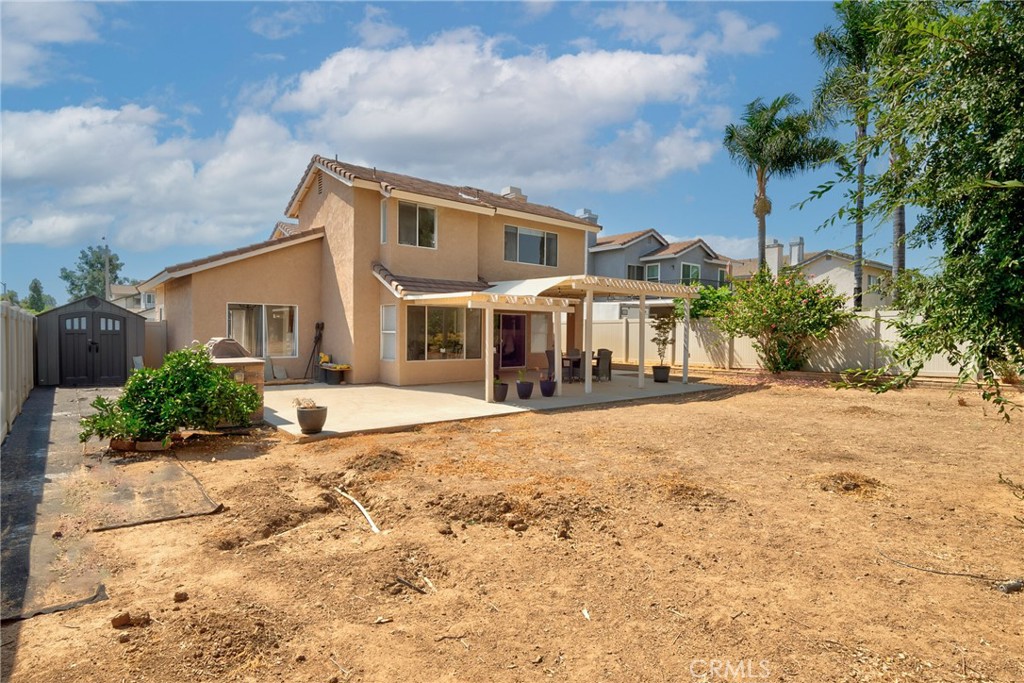 9376 Ruby Red Court Riverside, CA 92508 - Photo 47 of 54 a front view of a house with a yard